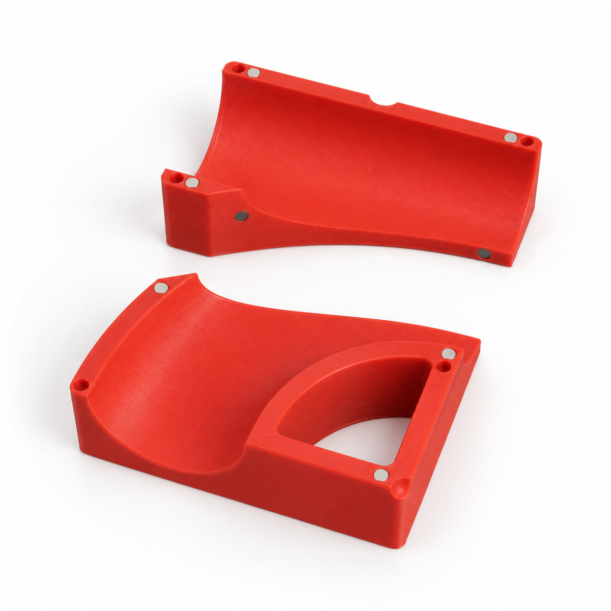 Tube block and bend block halves separated, showing the magnets on the curved face