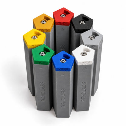 Tungsten holder tubes standing in a ring, seen from above, lids in eight colours